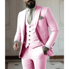 A man wears a slim-fit, light pink three-piece suit with a matching jacket, vest, and trousers.