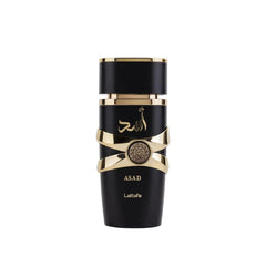 A black cylindrical Lattafa Asad perfume bottle with gold accents and a circular emblem.