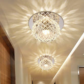 Two round, crystal-style flush mount ceiling lights installed in a hallway.