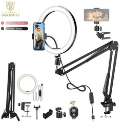 A dimmable LED ring light with a folding arm stand, phone holder, and remote control.