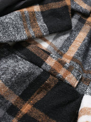 A close-up view of a men's casual plaid blazer featuring a brushed polyester fabric.