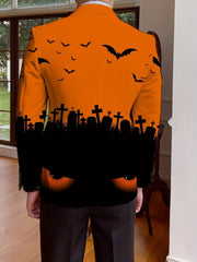 A man wears an orange single-breasted suit jacket featuring a Halloween graveyard and bat print.