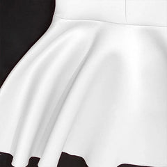 A close-up view of the white flared skirt portion of a mermaid-style dress.