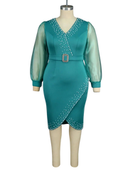 A teal V-neck sheath dress with sheer lantern sleeves, a beaded belt, and pearl embellishments.