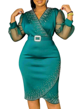 A teal midi-length sheath dress with a V-neck, beaded accents, and sheer puff sleeves.