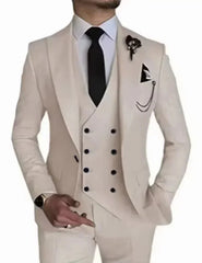 A man wears a cream-colored three-piece suit with a double-breasted vest and a black tie.