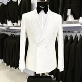 A white double-breasted suit jacket with a black shawl lapel and bow tie on a mannequin.
