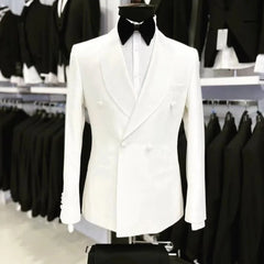 A white double-breasted suit jacket with a black shawl lapel and bow tie on a mannequin.