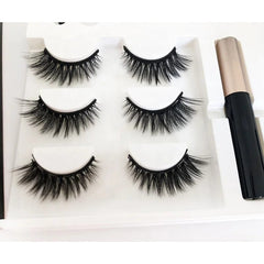 A set of three pairs of magnetic false eyelashes with a tube of magnetic eyeliner in a white tray.