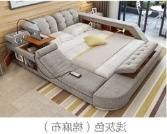 A grey upholstered smart bed frame featuring built-in storage, a laptop desk, and speakers.