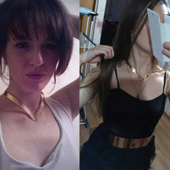 A woman wears a shiny gold-tone geometric V-shaped metal torque choker necklace.