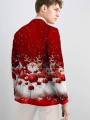 A man wears a red blazer featuring a festive Christmas print with Santa, reindeer, and ornaments.
