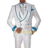 A man wears a white three-piece suit with teal trim on the lapels, cuffs, and vest.