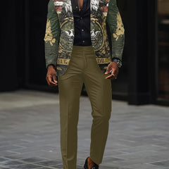 A man wears a two-piece suit featuring a digital print eagle jacket and olive green trousers.