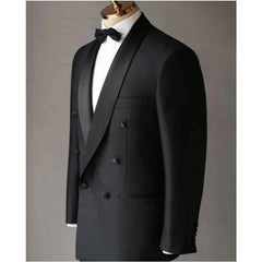 A black double-breasted tuxedo jacket with a satin shawl lapel on a mannequin.