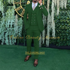 A man wears a dark green three-piece suit consisting of a single-breasted jacket, vest, and trousers.