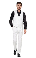 A man wears a white slim-fit vest and matching trousers paired with a black button-down shirt.