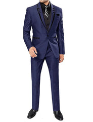 A man wears a navy blue three-piece suit with black lapel trim, a black vest, and a patterned tie.