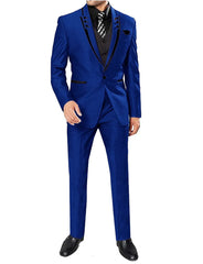 A man wears a royal blue three-piece suit with black lapel trim, a black vest, and black shoes.