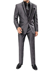A man wears a grey three-piece suit with black lapel trim, a black shirt, and a patterned tie.