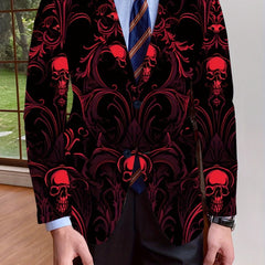 A man wears a black blazer featuring an all-over red skull and ornate damask print.