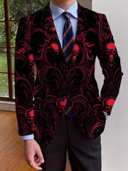 A man wears a black blazer featuring a red skull and ornate scrollwork pattern.