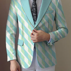 A man wears a regular fit casual suit jacket featuring a light blue and green geometric print.