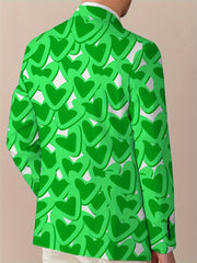 A man wears a regular-fit blazer featuring an all-over green heart pattern.