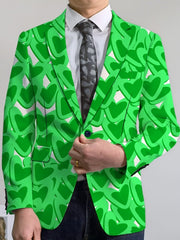 A man wears a green blazer featuring a repeating heart pattern over a white shirt and tie.