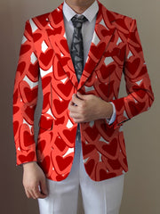 A man wears a red blazer featuring a repeating heart pattern over a white shirt and tie.