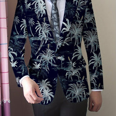 A man wears a navy blue blazer featuring a white coconut tree print with a button closure.