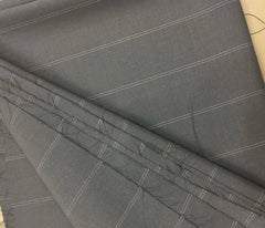 A close-up view of grey fabric featuring a subtle white pinstripe pattern.