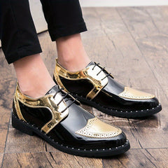 Men's black and gold glossy wingtip oxford shoes with perforated detailing and a rubber sole.
