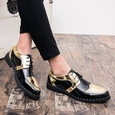 A pair of men's black and gold glossy wingtip oxford shoes with perforated detailing.