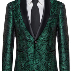 A men's emerald green paisley patterned suit jacket with a black satin shawl lapel and a black tie.