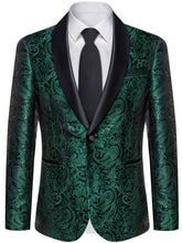 A men's emerald green paisley patterned suit jacket with a black shawl lapel and a matching tie.