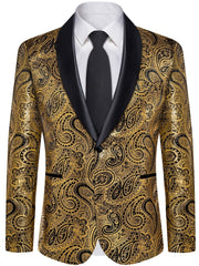 A men's gold and black paisley print suit jacket with a black shawl lapel and a matching tie.