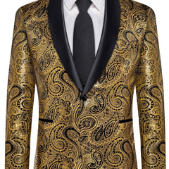 A men's gold and black paisley patterned suit jacket with a black shawl lapel and matching tie.