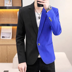 A man wears a casual, single-breasted blazer featuring a black and blue colorblock design.