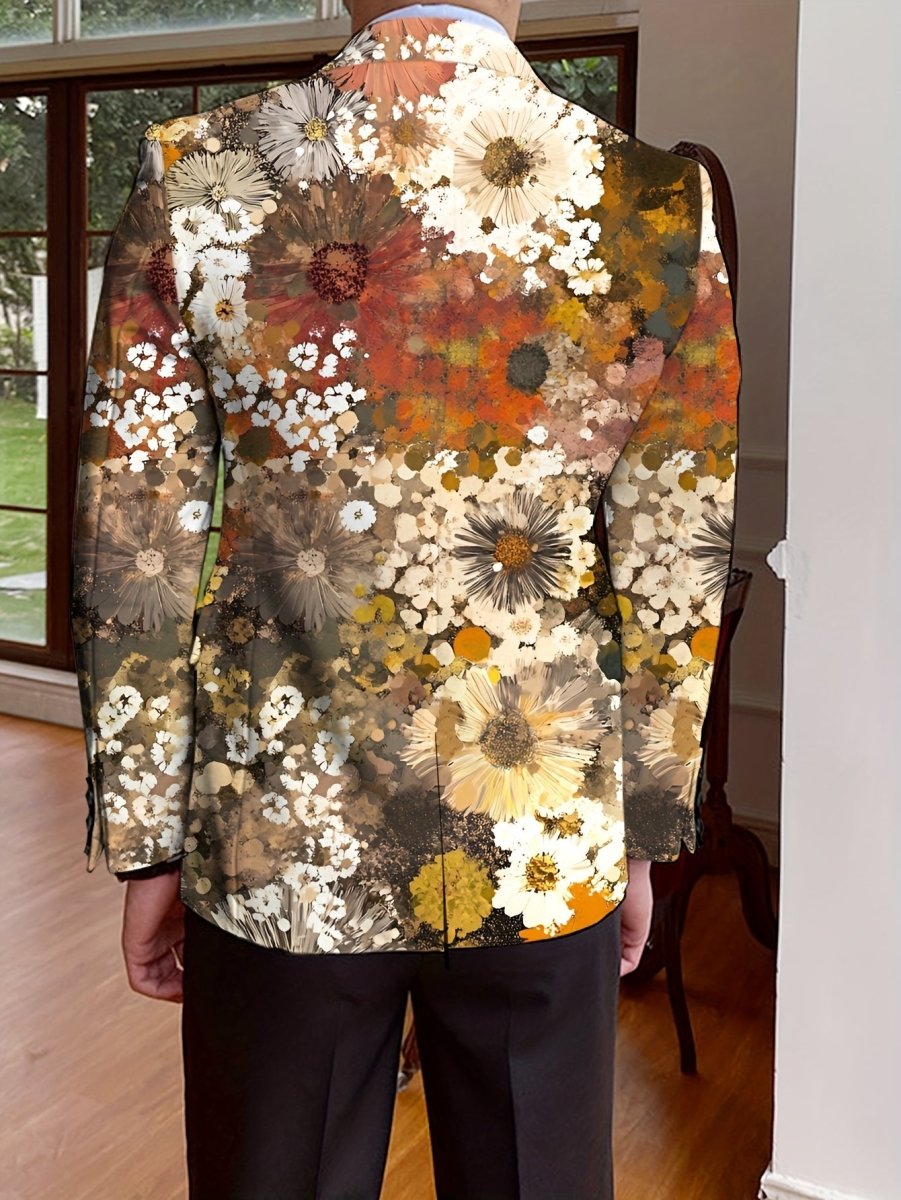 A man wears a single-breasted blazer featuring an all-over floral print in warm earth tones.