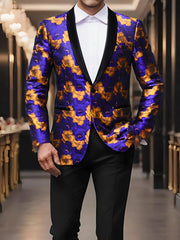 A man wears a purple and orange floral print blazer with a black shawl lapel and one button.