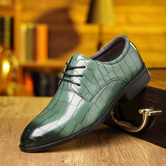 A glossy green men's dress shoe with a crocodile-patterned finish and black lace-up closure.
