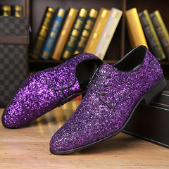 A pair of men's purple glitter lace-up dress shoes with a pointed toe design.