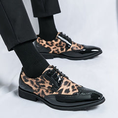 Men's leopard print lace-up oxford dress shoes with a black pointed toe and sole.