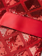 A close-up of a red sequined suit jacket featuring a geometric pattern and a satin shawl collar.