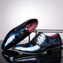 Men's pointed-toe dress shoes in a glossy blue floral pattern with black lace-up closures.