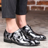 Men's black and white floral print pointed-toe dress shoes with a lace-up closure.