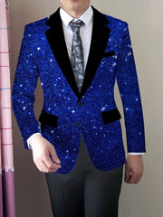 A man wears a slim-fit blue blazer with a starry print, black lapels, and button details.