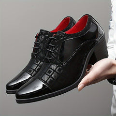 A pair of black lace-up dress shoes with a block heel, patent leather toe, and textured panels.