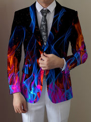 A man wears a blazer featuring a vibrant blue and red flame print over a white shirt and tie.